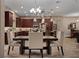 Gourmet kitchen with dark wood cabinets, pendant lights, and stainless steel appliances at 5430 Nw 35Th Lane Rd, Ocala, FL 34482