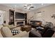 Cozy living room with a fireplace, built-in bookshelves, and comfortable seating at 5430 Nw 35Th Lane Rd, Ocala, FL 34482