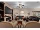 Comfortable living room featuring a fireplace, television, and bookshelves at 5430 Nw 35Th Lane Rd, Ocala, FL 34482
