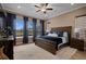 Serene main bedroom with a large bed, plush carpet, and bright windows at 5430 Nw 35Th Lane Rd, Ocala, FL 34482