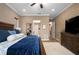 This main bedroom has a king bed, area rug, and hardwood floors at 5430 Nw 35Th Lane Rd, Ocala, FL 34482