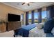 The main bedroom has golf course views, light walls, a ceiling fan and beautiful decor at 5430 Nw 35Th Lane Rd, Ocala, FL 34482