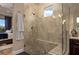 The bathroom features a glass shower with tiled walls, a shower bench and pebble tile flooring at 5430 Nw 35Th Lane Rd, Ocala, FL 34482