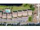 Aerial view of the community including the pool, parking, landscaping, and water feature nearby at 576 Belltower Ave # 100, Deltona, FL 32725