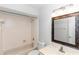 Bathroom featuring a tub-shower combination, toilet, and a vanity with framed mirror at 576 Belltower Ave # 100, Deltona, FL 32725