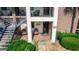 Inviting covered entryway with seating and decor, tiled porch and decorative door in the front at 576 Belltower Ave # 100, Deltona, FL 32725