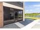 Exterior screened-in porch provides scenic views of the lake with beautiful Florida foliage at 576 Belltower Ave # 100, Deltona, FL 32725
