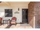 Inviting front porch with comfortable seating and decorative accents, perfect for relaxing outdoors at 576 Belltower Ave # 100, Deltona, FL 32725