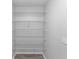 Walk-in pantry with ample shelving for organized storage at 576 Belltower Ave # 100, Deltona, FL 32725
