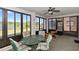 Screened porch with comfortable seating and beautiful views of a nearby pond at 576 Belltower Ave # 100, Deltona, FL 32725