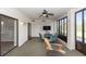Inviting screened porch with a ceiling fan, comfortable seating, and bright natural light at 576 Belltower Ave # 100, Deltona, FL 32725