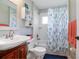 Full bathroom with shower, bathtub and decorative shower curtain at 5776 White Acres Ln, Port Orange, FL 32127
