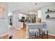 Modern kitchen with white cabinets, stainless steel appliances, and a breakfast bar at 5776 White Acres Ln, Port Orange, FL 32127