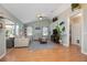 Bright and airy living room with hardwood floors, comfortable seating, and natural light at 5776 White Acres Ln, Port Orange, FL 32127