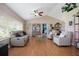 Spacious living room featuring vaulted ceilings, hardwood floors, and plenty of natural light at 5776 White Acres Ln, Port Orange, FL 32127
