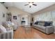 Comfortable living room with hardwood floors, neutral decor, and ample seating at 5776 White Acres Ln, Port Orange, FL 32127