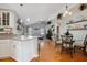 Open-concept kitchen and living area featuring hardwood floors and neutral walls at 5776 White Acres Ln, Port Orange, FL 32127