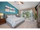 Relaxing main bedroom with a sliding glass door to a covered patio at 5776 White Acres Ln, Port Orange, FL 32127