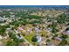 Expansive aerial shot showcases home with spacious yard, mature trees and neighborhood setting at 707 Hamilton St, New Smyrna Beach, FL 32168