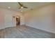 Spacious bedroom with ensuite bathroom access and wood-look floors at 707 Hamilton St, New Smyrna Beach, FL 32168