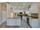 Beautiful kitchen with white cabinets, granite countertops, and stainless steel appliances at 707 Hamilton St, New Smyrna Beach, FL 32168