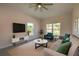 Cozy living room with plush seating, modern decor, and bright natural light at 707 Hamilton St, New Smyrna Beach, FL 32168