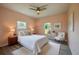 Bedroom with a bed, side tables, lamps, and white accents at 707 Hamilton St, New Smyrna Beach, FL 32168