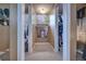 Hallway leads to the bedrooms, featuring a neutral palette and closet space at 738 Lindley Blvd, Deland, FL 32724