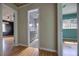 Hallway view leading to a bathroom with gray vanity and tiled walls at 738 Lindley Blvd, Deland, FL 32724