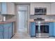 Modern kitchen with stainless steel appliances, wood countertops, and stylish backsplash at 738 Lindley Blvd, Deland, FL 32724