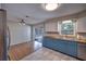 Open kitchen and dining area with stainless steel appliances, butcher block countertops, and a view to the backyard at 738 Lindley Blvd, Deland, FL 32724