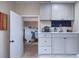 Laundry room features shaker cabinets, light countertop and storage space at 738 Lindley Blvd, Deland, FL 32724