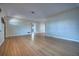 Spacious open-concept living area with gleaming hardwood floors and neutral wall colors at 738 Lindley Blvd, Deland, FL 32724
