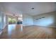 Spacious living area with hardwood floors flowing into the kitchen and leading to an outdoor patio at 738 Lindley Blvd, Deland, FL 32724