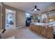 Main bedroom offers carpet flooring, ceiling fan, and large windows for natural light at 738 Lindley Blvd, Deland, FL 32724