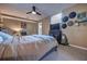 Main bedroom features carpet flooring, ceiling fan, and TV on top of decorative furniture at 738 Lindley Blvd, Deland, FL 32724
