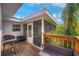Exterior view of screened porch with grill and outdoor seating on wood deck at 738 Lindley Blvd, Deland, FL 32724