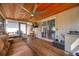 Relaxing screened porch features wood ceiling, ceiling fan, and comfortable seating at 738 Lindley Blvd, Deland, FL 32724