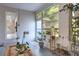 Bright sunroom features white brick walls, large windows and door that lead to the outside at 738 Lindley Blvd, Deland, FL 32724