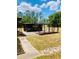 Spacious backyard featuring a large patio area perfect for outdoor entertaining at 7380 Orange Ave, Indian Lake Estates, FL 33855