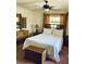 Bedroom featuring bamboo frame bed and matching dresser and nightstand at 7380 Orange Ave, Indian Lake Estates, FL 33855