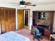 Bedroom with a ceiling fan, closet, and a workstation, perfect for a home office at 7380 Orange Ave, Indian Lake Estates, FL 33855