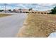 Expansive building with ample parking and a sizable grassy area, perfect for outdoor activities at 7380 Orange Ave, Indian Lake Estates, FL 33855