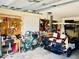 Spacious garage featuring a golf cart, ample storage, and workspace for hobbies at 7380 Orange Ave, Indian Lake Estates, FL 33855