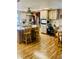 Kitchen area with island seating and a workspace at 7380 Orange Ave, Indian Lake Estates, FL 33855