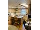 Kitchen features laminate countertops, wood cabinets and an island with bar seating at 7380 Orange Ave, Indian Lake Estates, FL 33855