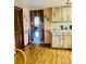 Cozy kitchen features wood cabinets, laminate countertop, and dining nook at 7380 Orange Ave, Indian Lake Estates, FL 33855