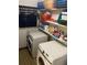 Laundry room featuring side-by-side machines and well-organized shelving at 7380 Orange Ave, Indian Lake Estates, FL 33855