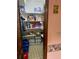 Organized pantry with shelving stocked with food and household supplies at 7380 Orange Ave, Indian Lake Estates, FL 33855