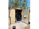 Open shed, paved tile pad, and a secure, covered space for projects or extra storage at 7380 Orange Ave, Indian Lake Estates, FL 33855